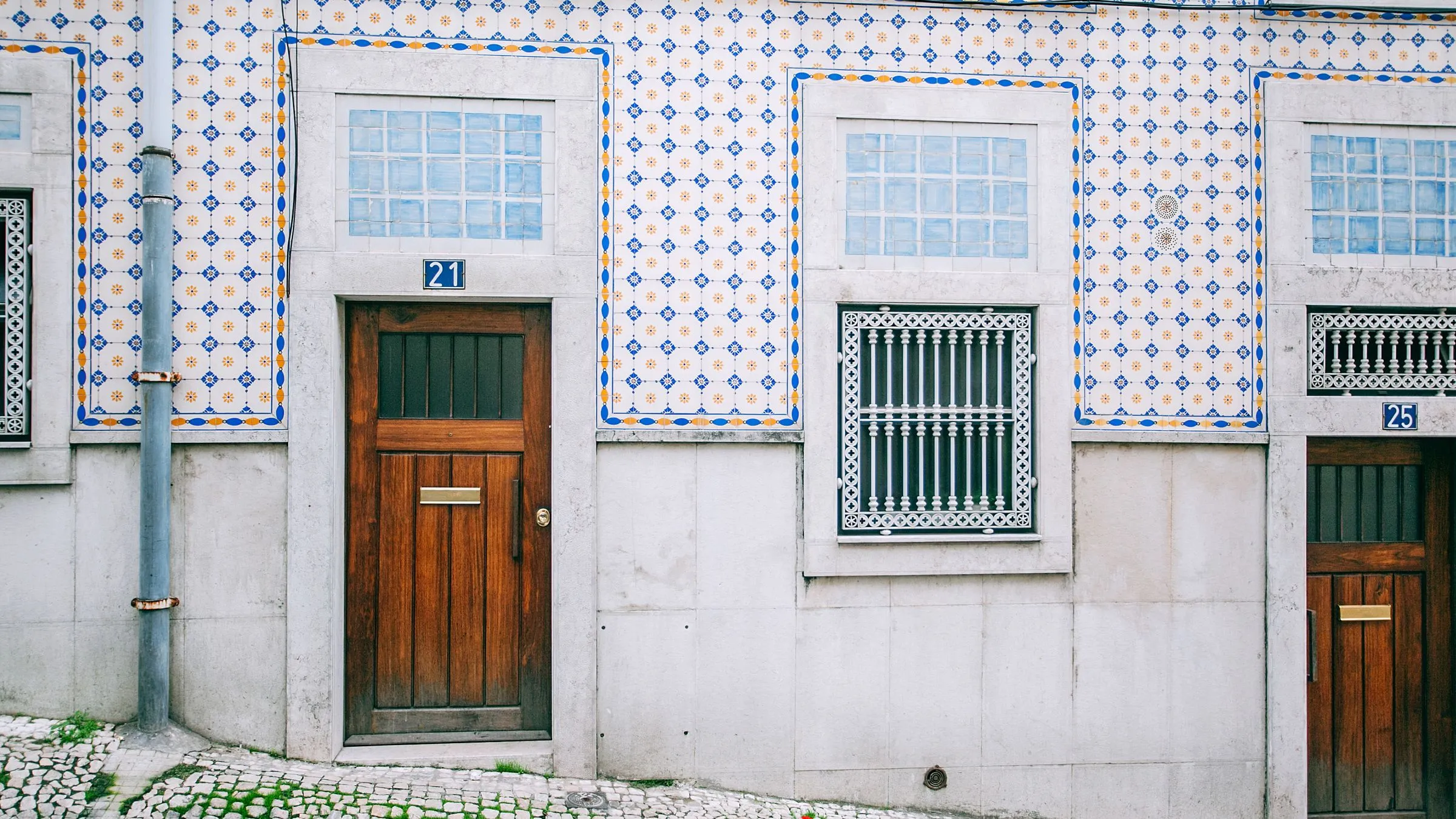 Portuguese apartment exterior with traditional tiles and wooden doors